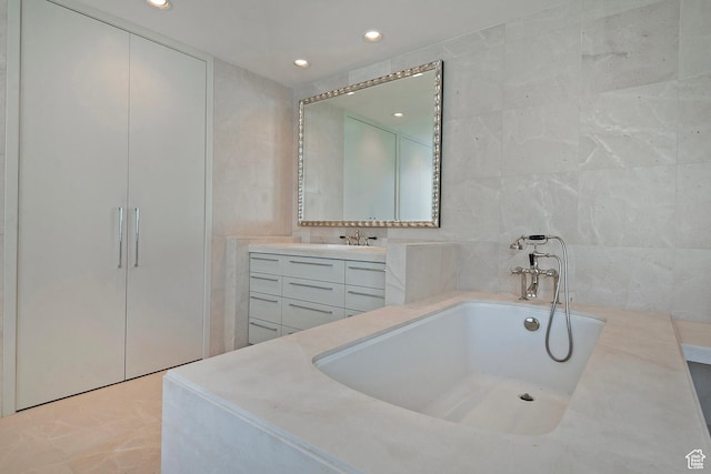 268 S State St E Unit 418, Salt Lake City, UT 84111 - bathroom with vanity, tile walls, and a bathing tub