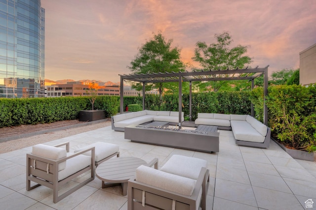 268 S State St E Unit 418, Salt Lake City, UT 84111 - patio terrace at dusk featuring a pergola and an outdoor living space with a fire pit