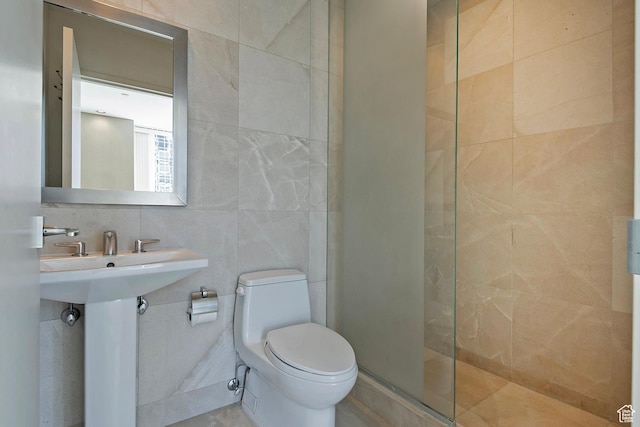 268 S State St E Unit 418, Salt Lake City, UT 84111 - bathroom with sink, tile walls, toilet, and an enclosed shower