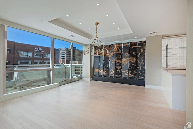268 S State St E Unit 418, Salt Lake City, UT 84111 - unfurnished room with hardwood / wood-style floors, a wall of windows, and a raised ceiling