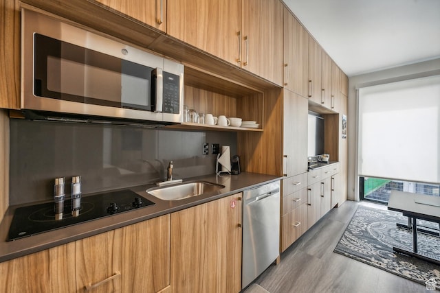 2670 W Canyons Resort Dr Unit 207, Park City, UT 84098 - kitchen with dark wood-type flooring, sink, and appliances with stainless steel finishes