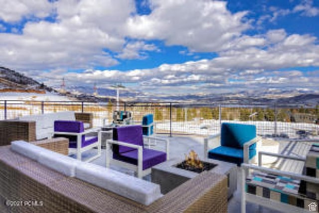 2670 W Canyons Resort Dr Unit 207, Park City, UT 84098 - snow covered patio with a mountain view and an outdoor living space with a fire pit