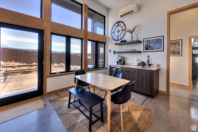 171 E Mt Peale Dr, Moab, UT 84532 - dining space featuring a wall mounted air conditioner, bar, and plenty of natural light