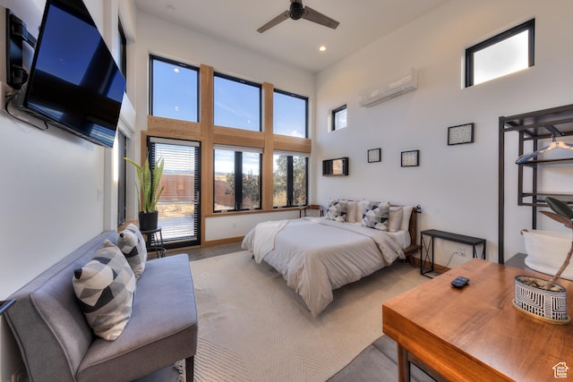 171 E Mt Peale Dr, Moab, UT 84532 - bedroom featuring ceiling fan, a high ceiling, and a wall mounted air conditioner