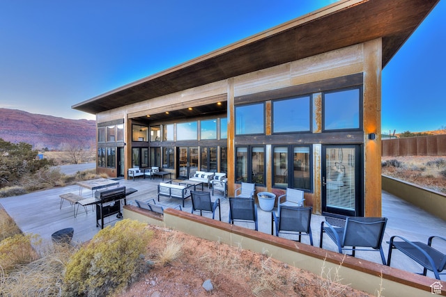 171 E Mt Peale Dr, Moab, UT 84532 - view of patio / terrace with a mountain view and an outdoor living space