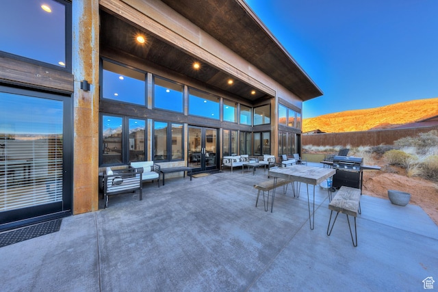 171 E Mt Peale Dr, Moab, UT 84532 - patio terrace at dusk with a mountain view and outdoor lounge area