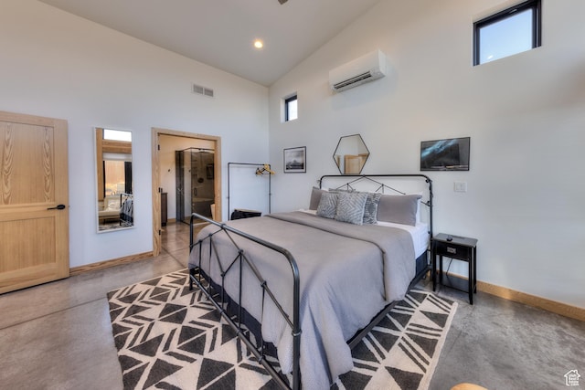 171 E Mt Peale Dr, Moab, UT 84532 - bedroom featuring concrete floors, a wall unit AC, and a towering ceiling