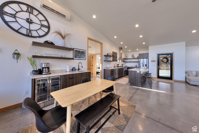 171 E Mt Peale Dr, Moab, UT 84532 - dining area with vaulted ceiling, wet bar, beverage cooler, and a wall unit AC