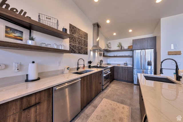171 E Mt Peale Dr, Moab, UT 84532 - kitchen with sink, light stone counters, island exhaust hood, and appliances with stainless steel finishes