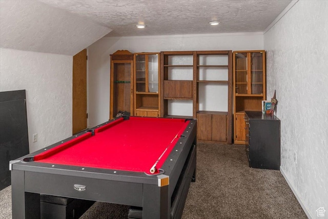 playroom featuring pool table, a textured ceiling, vaulted ceiling, and dark carpet