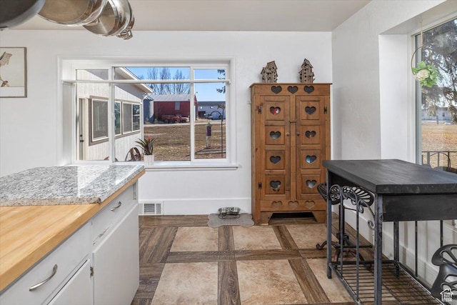 kitchen with white cabinets