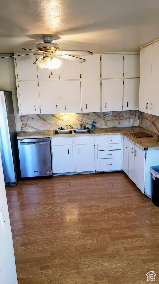 449 E 3rd S, Price, UT 84501 - kitchen featuring stainless steel appliances, ceiling fan, a sink, white cabinets, and backsplash