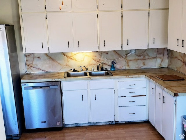 449 E 3rd S, Price, UT 84501 - kitchen with appliances with stainless steel finishes, white cabinets, and tasteful backsplash
