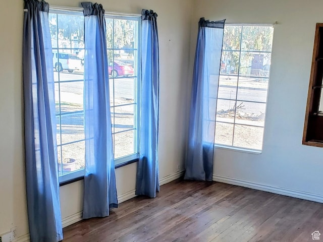 449 E 3rd S, Price, UT 84501 - spare room featuring wood finished floors and plenty of natural light