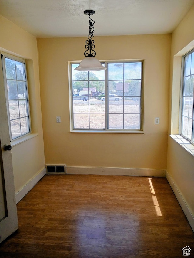 449 E 3rd S, Price, UT 84501 - unfurnished dining area featuring wood finished floors and baseboards
