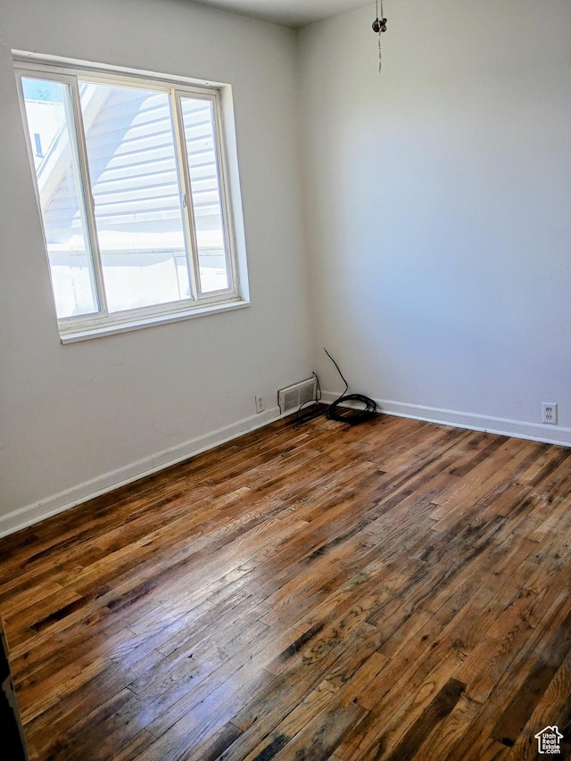 449 E 3rd S, Price, UT 84501 - unfurnished room with dark wood-style flooring and baseboards