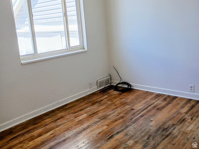 449 E 3rd S, Price, UT 84501 - empty room featuring dark wood-style flooring and baseboards