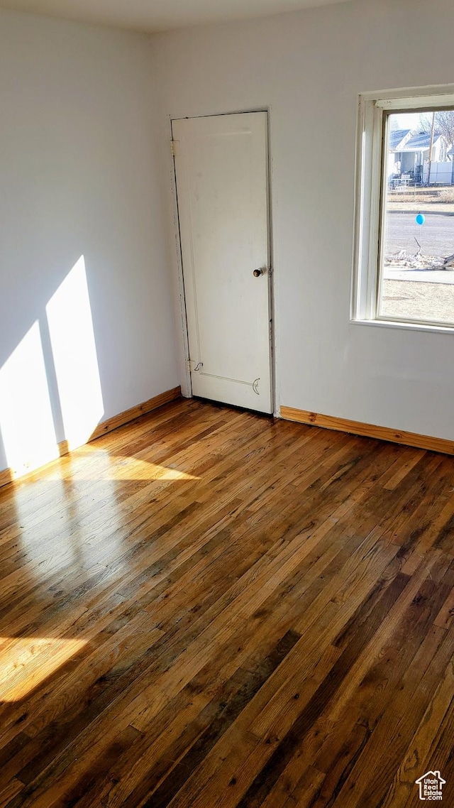 449 E 3rd S, Price, UT 84501 - unfurnished room with dark wood finished floors and baseboards