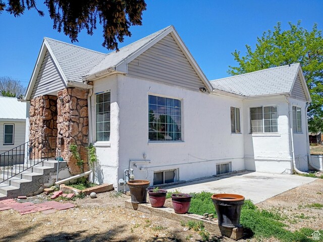 449 E 3rd S, Price, UT 84501 - view of side of home featuring a patio area and stucco siding