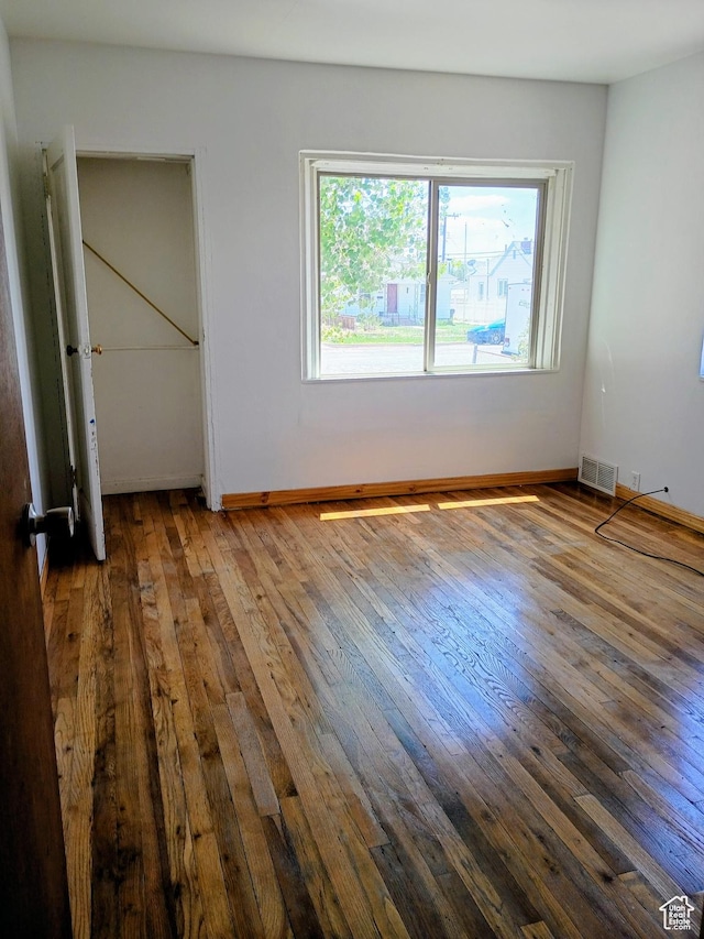 449 E 3rd S, Price, UT 84501 - unfurnished bedroom featuring hardwood / wood-style flooring and baseboards