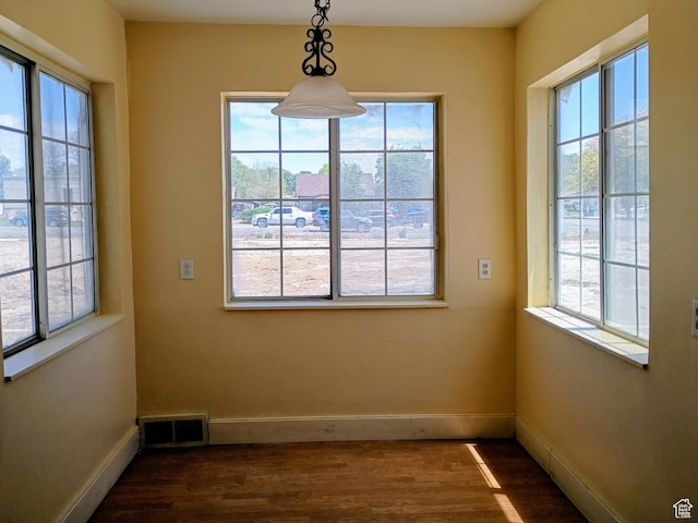 449 E 3rd S, Price, UT 84501 - empty room featuring healthy amount of natural light and dark wood finished floors