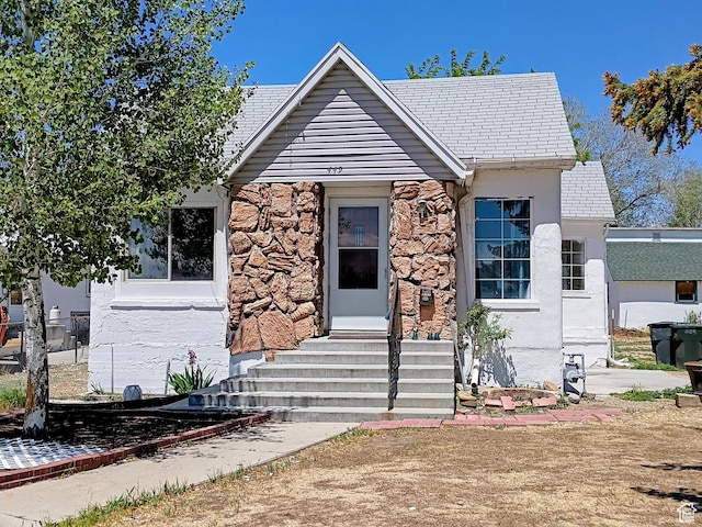 449 E 3rd S, Price, UT 84501 - view of front of home with entry steps, stone siding, and stucco siding