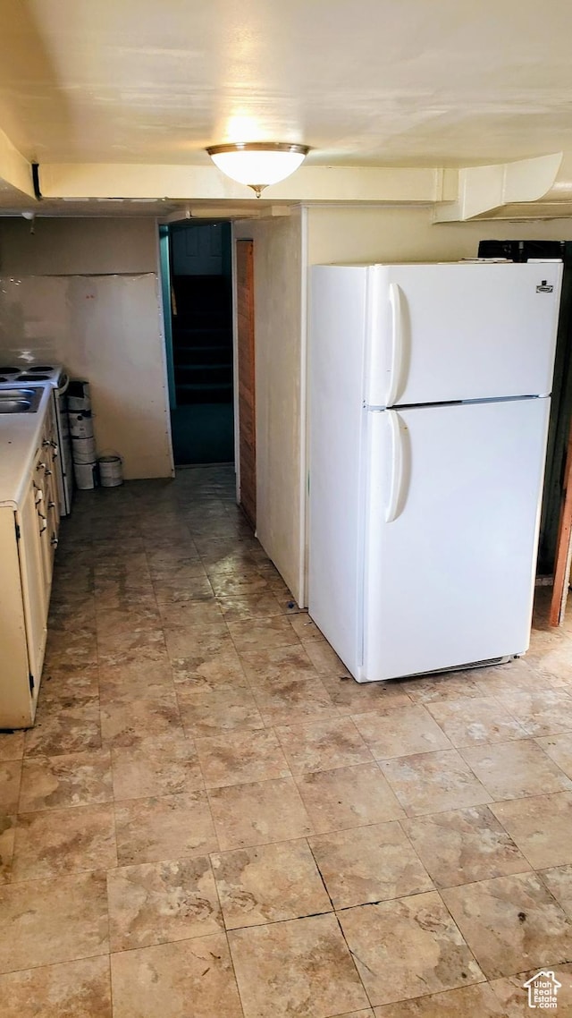 449 E 3rd S, Price, UT 84501 - kitchen featuring freestanding refrigerator, light countertops, and a sink