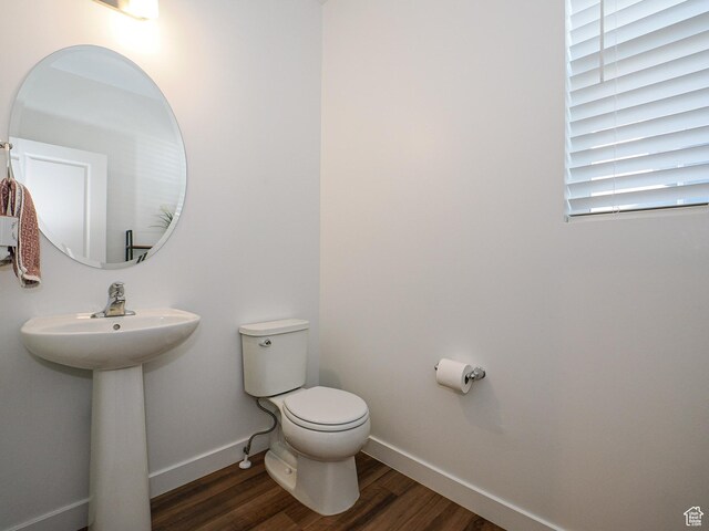 1766 E Johnstown Rd N Unit 710, Eagle Mountain, UT 84005 - half bath featuring baseboards, a sink, wood finished floors, and toilet