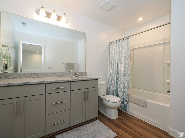 1766 E Johnstown Rd N Unit 710, Eagle Mountain, UT 84005 - bathroom with double vanity, visible vents, wood finished floors, a sink, and toilet