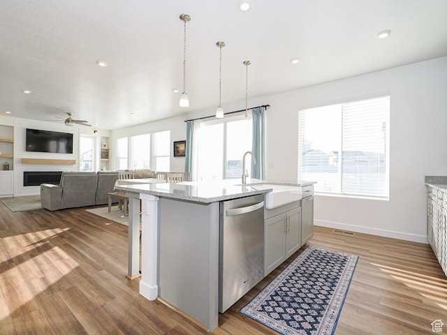 1766 E Johnstown Rd N Unit 710, Eagle Mountain, UT 84005 - kitchen with ceiling fan, a sink, gray cabinets, wood finished floors, and stainless steel dishwasher