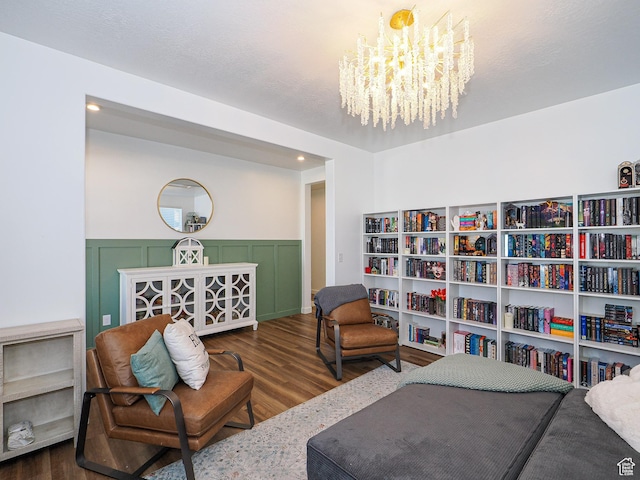 1766 E Johnstown Rd N Unit 710, Eagle Mountain, UT 84005 - living area featuring an inviting chandelier, wood finished floors, and a wainscoted wall