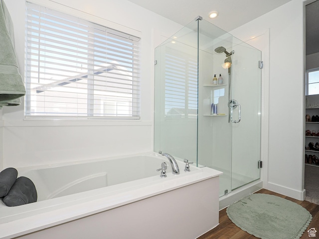 1766 E Johnstown Rd N Unit 710, Eagle Mountain, UT 84005 - bathroom with a garden tub, wood finished floors, and a shower stall