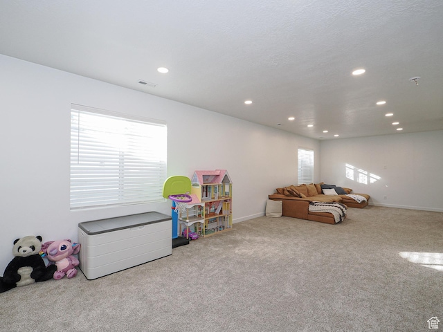 1766 E Johnstown Rd N Unit 710, Eagle Mountain, UT 84005 - recreation room featuring baseboards, carpet, recessed lighting, and visible vents