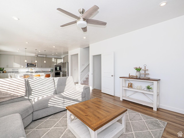 1766 E Johnstown Rd N Unit 710, Eagle Mountain, UT 84005 - living room with recessed lighting, stairs, ceiling fan, and light wood-type flooring