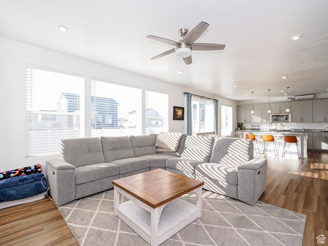 1766 E Johnstown Rd N Unit 710, Eagle Mountain, UT 84005 - living room with ceiling fan, recessed lighting, and light wood-style flooring