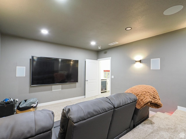 1766 E Johnstown Rd N Unit 710, Eagle Mountain, UT 84005 - carpeted living room featuring beverage cooler, recessed lighting, baseboards, and visible vents