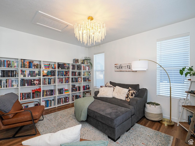 1766 E Johnstown Rd N Unit 710, Eagle Mountain, UT 84005 - sitting room featuring baseboards, a chandelier, wood finished floors, and attic access