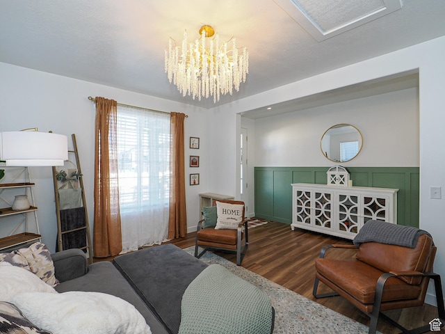 1766 E Johnstown Rd N Unit 710, Eagle Mountain, UT 84005 - living area featuring an inviting chandelier, wainscoting, and wood finished floors