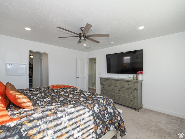 1766 E Johnstown Rd N Unit 710, Eagle Mountain, UT 84005 - bedroom with ceiling fan, light colored carpet, a textured ceiling, recessed lighting, and baseboards