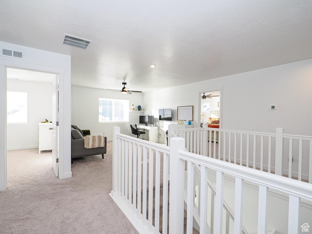 1766 E Johnstown Rd N Unit 710, Eagle Mountain, UT 84005 - corridor featuring light colored carpet, visible vents, and an upstairs landing