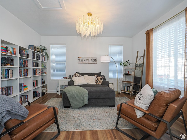1766 E Johnstown Rd N Unit 710, Eagle Mountain, UT 84005 - bedroom with baseboards, a chandelier, and wood finished floors