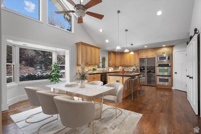 1790 N 120 E, Orem, UT 84057 - dining room with sink, dark wood-type flooring, a barn door, and ceiling fan