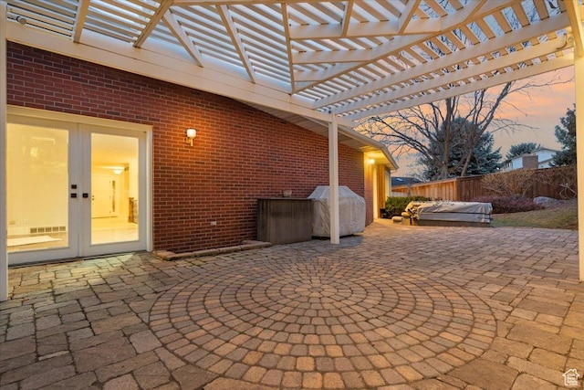 1790 N 120 E, Orem, UT 84057 - patio terrace at dusk featuring french doors, grilling area, a jacuzzi, and a pergola