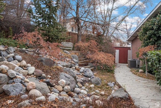 1790 N 120 E, Orem, UT 84057 - view of yard featuring central AC unit and a storage shed