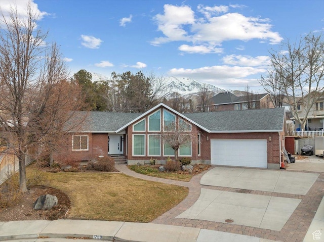 1790 N 120 E, Orem, UT 84057 - view of front facade with a garage, a mountain view, and a front yard