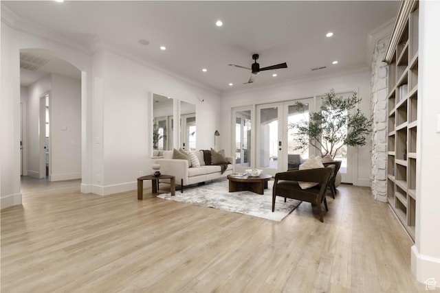 1783 N Firerock Cir, Washington, UT 84780 - living room featuring crown molding, light hardwood / wood-style flooring, and french doors