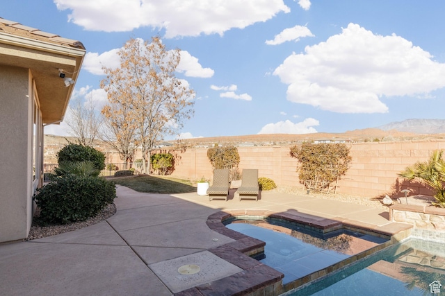 1783 N Firerock Cir, Washington, UT 84780 - view of patio featuring a fenced in pool and a mountain view