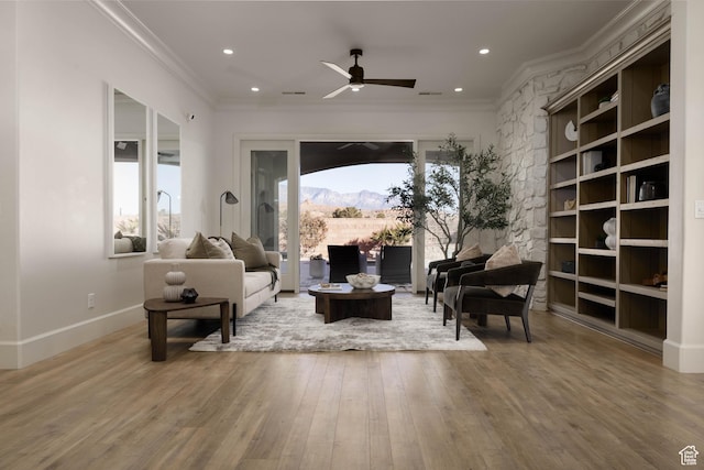 1783 N Firerock Cir, Washington, UT 84780 - sitting room featuring crown molding, hardwood / wood-style flooring, a mountain view, built in shelves, and ceiling fan