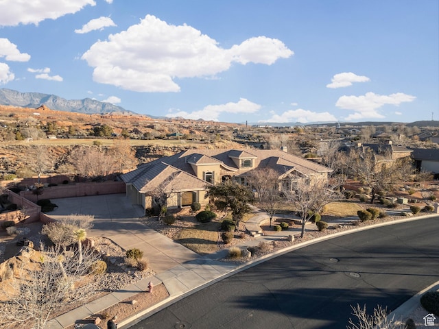 birds eye view of property featuring a mountain view