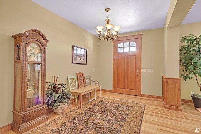 315 S Bear Lake Blvd, Garden City, UT 84028 - entrance foyer with light wood-style floors, a chandelier, and baseboards